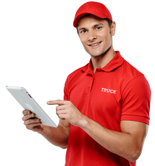 Logistics dispatch professional in red uniform using a tablet for truck scheduling and coordination